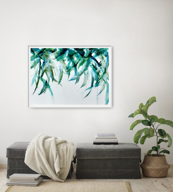 Leaves in a breeze - Original artwork of a blue green leaves hanging from above and gently blowing in the breeze. The hanging leaves contain reflections from the light above. The painting conveys a sense of serenity and elegance. The painting is shown hanging on a pale wall behind a seat and decorating items.