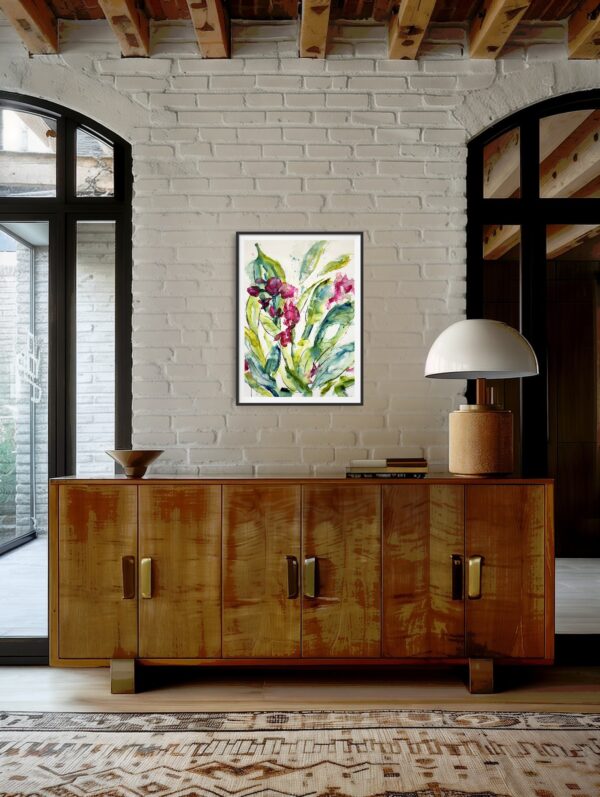 Original abstract painting of bright pink orchids and green leaves hanging on a beige wall above a wooden cabinet and decorating items