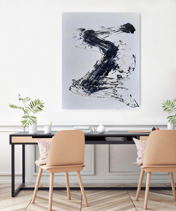 Moving Forward - Zen art abstract black and white painting depicting movement in bold Asian style brushstrokes. The painting is hanging on a pale wall behind a desk, seats and a pot plant.