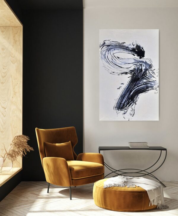 Power of the Serpent - Zen art abstract black and white painting depicting movement in bold Asian style brushstrokes. The painting is hanging on pale wall above a reading chair, table and decorating items.