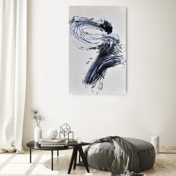Power of the Serpent - Zen art abstract black and white painting depicting movement in bold Asian style brushstrokes. The painting is hanging on a pale wall above a seat, table and decorating items.