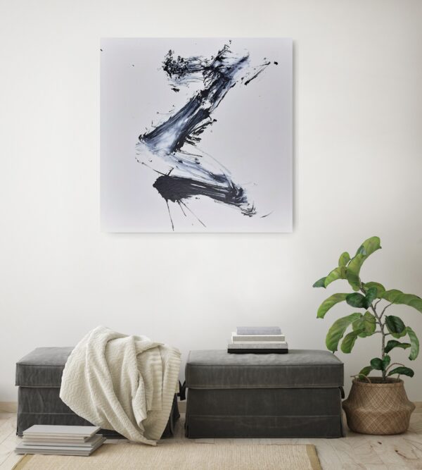 Rising to the Light - Zen art abstract black and white painting depicting movement in bold Asian style brushstrokes. The painting is hanging on a pale wall behind a seat and a pot plant.
