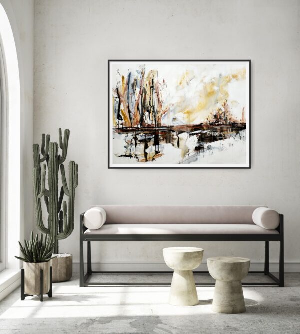 Lakeside Glory - An abstract landscape artwork portraying lake, trees, and the sky in natural colours of brown, ochre, black, white and grey. The painting is hanging on a pale wall, behind a sofa and coffee tables.