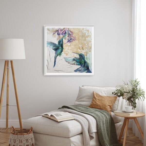 Hummingbird Jewels - Original artwork of two jade hummingbirds flying towards pink / purple Fushia flowers hanging on a pale gray wall behind a chase lounge with a standing light and small table.