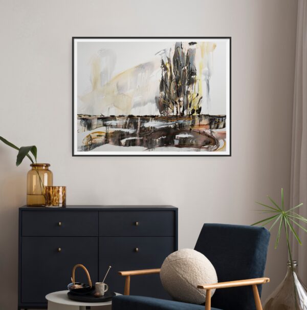 Light on Nature - a neutral abstract mixed media artwork portrays the beauty of the natural world. The tree line is reflected in the waterway and the sky shows reflections of the sunlight shining on all of nature. The painting is hanging above a black cabinet and dark blue chair with side table.