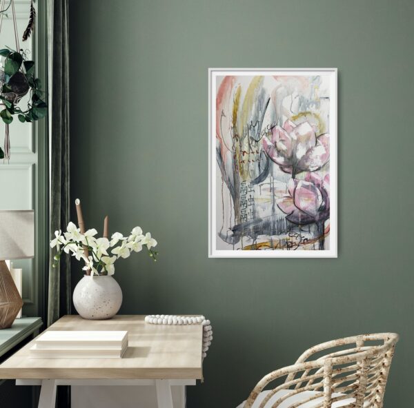 Lotus Heart - This mixed media painting portrays pale pink lotus flowers with an abstract background amidst Asian calligraphy for love and peace. Lotus flowers are representative of growing out of the muddy waters of life with purity, serenity and natural beauty. The painting is hanging on a green wall with a pale desk and cane chair. The desk has decorating items on it.
