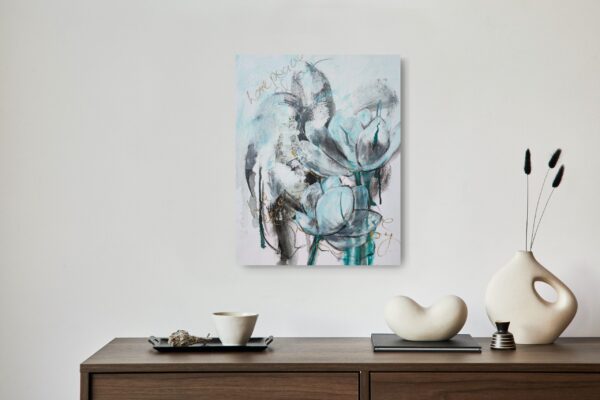 Lotus Love - This abstract mixed media artwork is a representation of a turquoise lotus flower. Various techniques and mediums such as Asian writing, positive statements, and bold brushwork were used in the background to add interest to the composition. The painting is shown hanging above a shelf and decorating items.