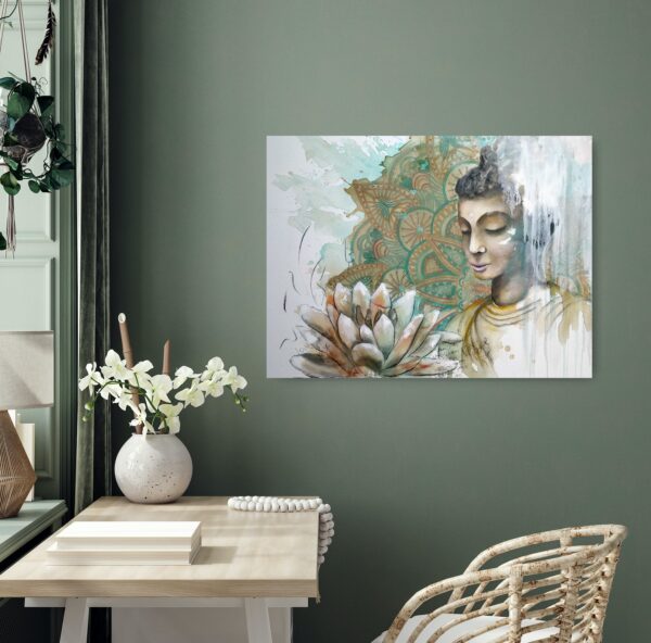 Mystical Heart - a mixed media painting portraying a female Buddha meditating, a pale apricot and ochre lotus flower in the foreground and a turquoise and ochre mandala patterned background. Lotus flowers are representative of growing out of the muddy waters of life with purity, serenity and natural beauty. The painting is hanging on a green wall behind a desk and cane chair.