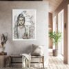 Peace Within - original artwork of a peaceful female Buddha meditating hanging on a pale grey wall above a seat with cushion and throw rug, and plants decorating the area. Light coming from the window to the right of the room.