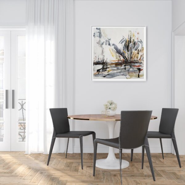 Stormy Outback - This abstract mixed media artwork portrays an outback lake, or billabong, with trees and scrubland emerging from the background amidst a storm. The painting is hanging a white wall in front of a table and chairs displaying decorating items.