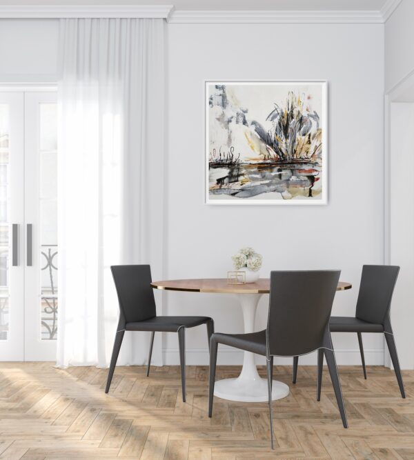 Stormy Outback - This abstract mixed media artwork portrays an outback lake, or billabong, with trees and scrubland emerging from the background amidst a storm. The painting is hanging a white wall in front of a table and chairs displaying decorating items.