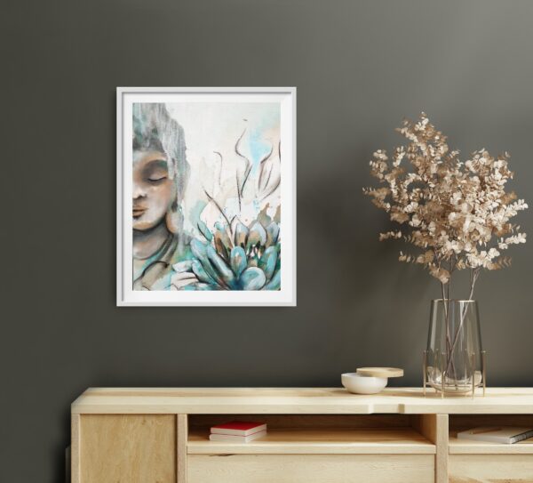 Through the Veil - original artwork of half a female Buddha's face peacefully meditating with a veil white covering some of her face and a turquoise lotus in the right-hand front hanging in room on a green wall with a wooden cabinet underneath displaying a vase of dried flowers , books and a small dish.