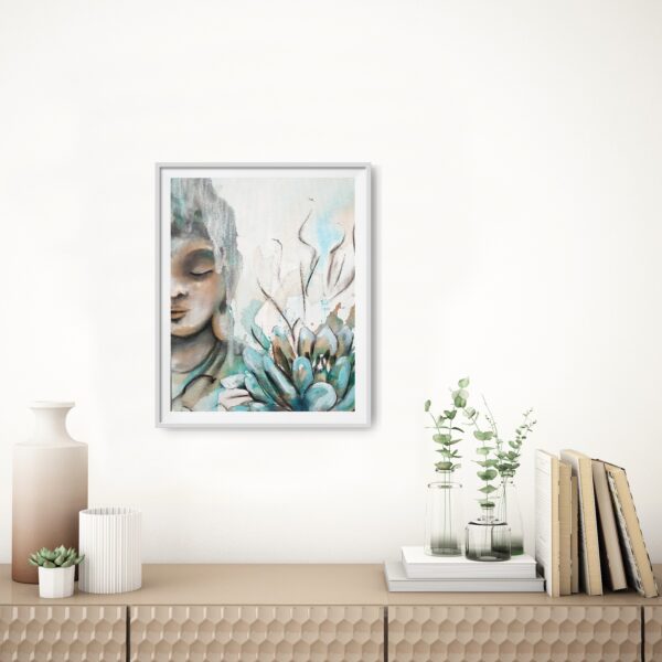 Through the Veil - original artwork of a half female Buddha face meditating hanging on a white wall in a room with a cabinet underneath displaying books, and vases with plants.