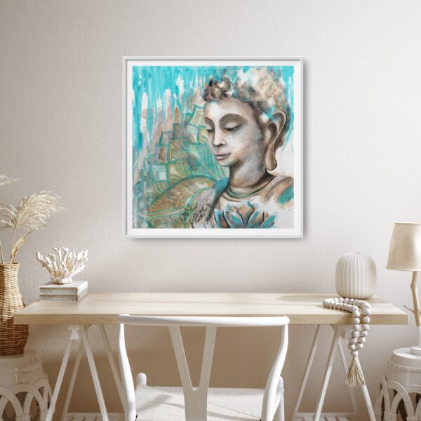Turquoise Devotion - An original artwork showing a female Buddha meditating. In the foreground is a turquoise lotus flower and in the background is a turquoise and ochre mandala pattern. The words love, peace and joy are written in the front. The painting is hanging on a cream wall with a wooden desk and white chair in front.