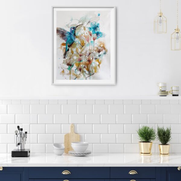 Jade Hummingbird in the Garden flying amongst turquoise, ochre and pink flowers and foliage original artwork in a room with dark blue set of cupboards like a kitchen.