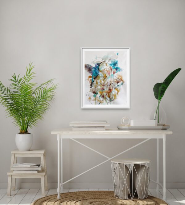 Jade Hummingbird flying amongst turquoise, ochre and pink flowers and foliage artwork in a room with a desk in front