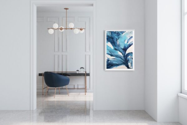 Bright blue and turquoise abstract artwork of waving underwater plants hanging on a white wall outside a room with a blue chair and marble desk.