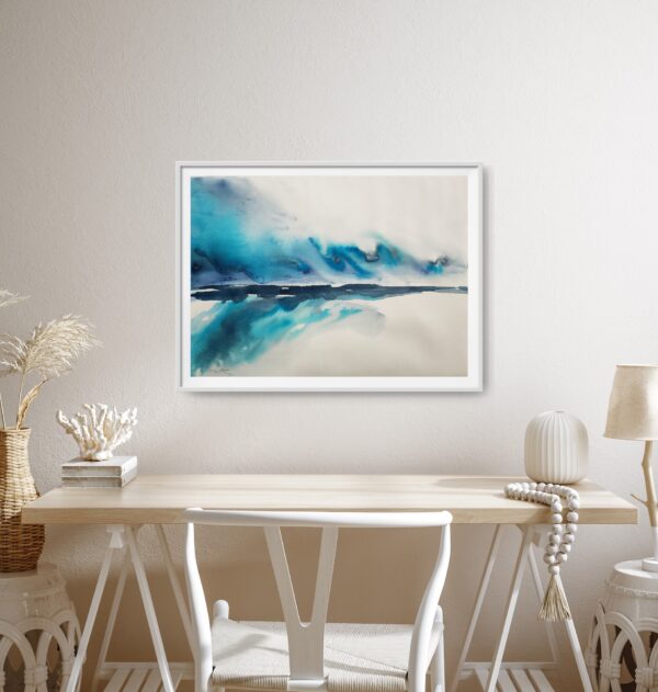 Bright blue and turquoise abstract seascape artwork hanging on a wall above a desk and chair.