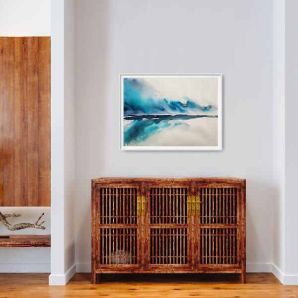 Bright blue and turquoise abstract seascape artwork hanging on a wall above a cabinet.