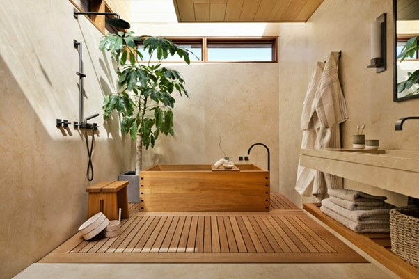 Japanese bathroom with wooden bath, plant and bathing items