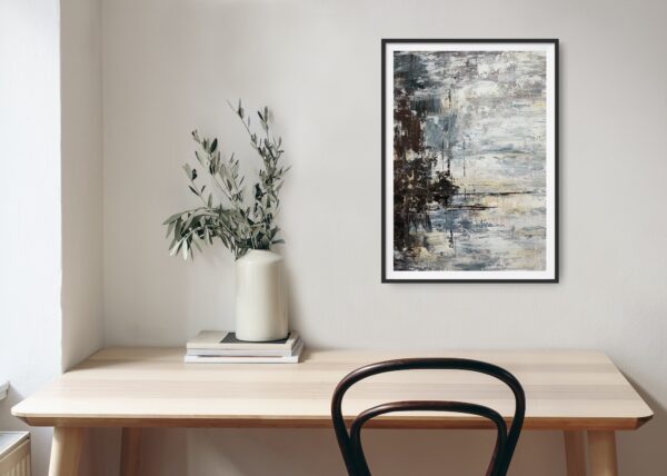 Abstract painting of a stormy sky and lake with trees to the side hanging over a desk and chair with decorating items